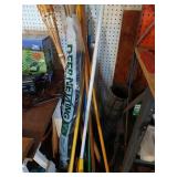 Lot of brooms, tiki torches etc