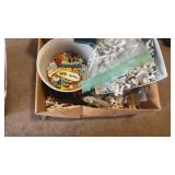 Box of various tees and ball markers