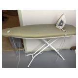 Ironing board with iron