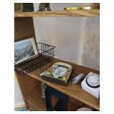 Shelf of misc framed art etc.