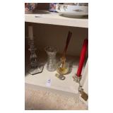 Assorted glass candle holders and vases
