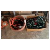 Lot of extension cords with a plastic planter pot