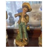 Young boy playing a flute (?) figurine *broken*