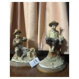 Young boys with dogs figurines