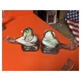 Two bird paper weights
