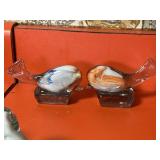 Two bird paper weights