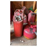 Vintage red metal safety gas can and red 5gal