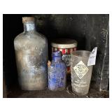 Milk of magnesium bottles, candy tin and acme