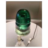 Glass insulator with a B on it