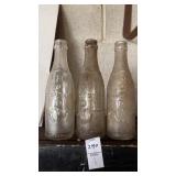 Vintage 1920-1930s embossed Howdy soda bottles