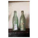 Vintage green glass Coca-Cola hobbleskirt bottles