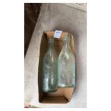 Lot of 2 vintage clear glass bottles from