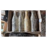 Lot of 9 clear glass bottles from Hoffman