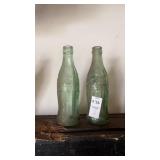 Vintage green glass Coca-Cola hobbleskirt bottles