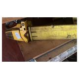 Vintage yellow McCullough gas powered chainsaw