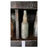 Antique green glass embossed bottle from Eastern
