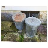 2 metal garbage cans