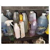 Shelf lot of antifreeze, window cleaner and car