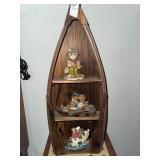 Boat trinket shelf with fishing figurines