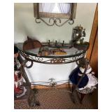 Ornate wrought iron and glass-top accent table