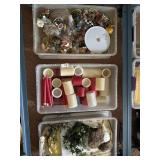 Plastic storage bins (with lids) of candles (some