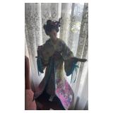 Oriental porcelain doll
