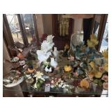 Shelf lot of bird figurines