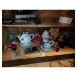 Contents of bottom shelf - various decorative