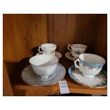 4 collector cups & saucers