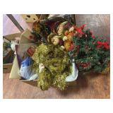 Box of Christmas wrapping supplies, mini tree and