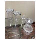5 plastic canisters
