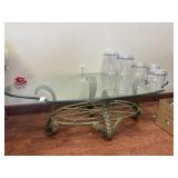 Glass oval coffee table with wrought iron base 52