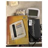 Calculator, battery charger, alarm clock