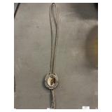 Vintage bolo tie with decorative horse medallion
