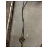 Vintage bolo tie with decorative medallion