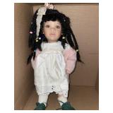 Porcelain doll with braided hair