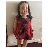 Vintage composition doll with braided brown hair