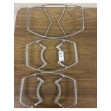 2 Corning Ware and 1 misc metal casserole trivet