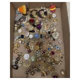Flat of vintage estate costume pendants and pins