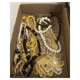 Flat of vintage estate costume necklaces