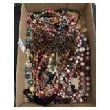 Flat of vintage estate costume necklaces