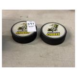 2 vintage Johnstown Chiefs hockey pucks