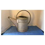 Vintage galvanized watering can