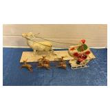 Vintage Santas and sleighs