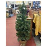 4ft lighted faux Christmas tree in planter