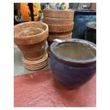 Terracotta planters and glazed ceramic pot