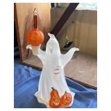 Acrylic ghost figurine holding bubble light