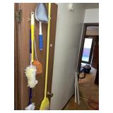 All cleaning items hanging on door