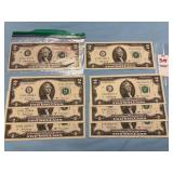Two sets of three consecutive serial numbered U.