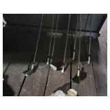 Assortment of golf clubs